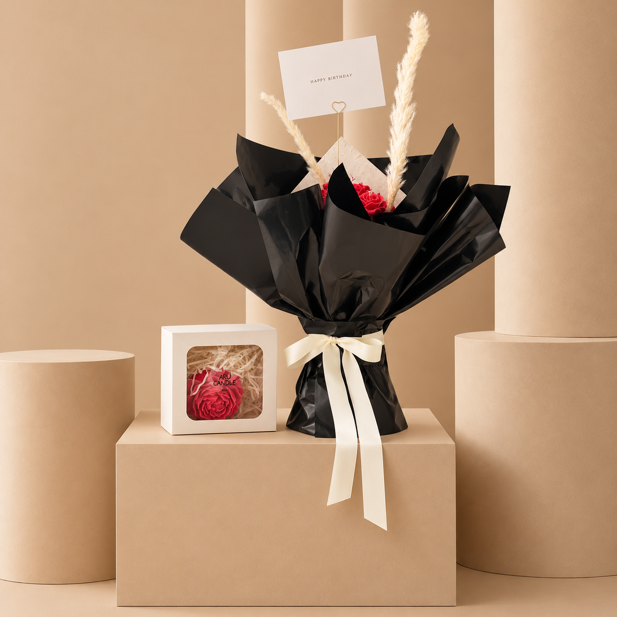 Red rose candle bouquet in black wrapping with pampas grass – Velvet Ember by Aru Candle Dubai